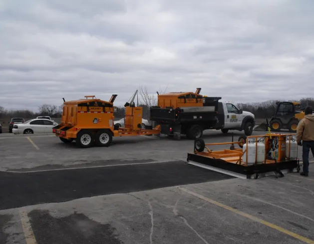 Photo of an km international asphalt hotbox used for asphalt road repair and maintenance for asphalt contractors  